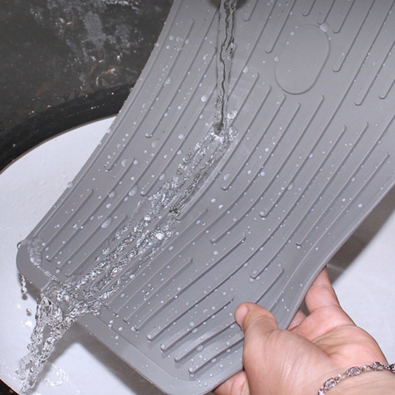 Buton dreptunghiular pentru a ține tamponul de scurgere