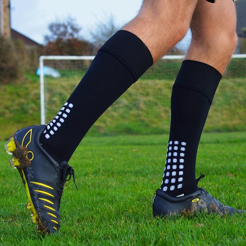 High quality football socks with your logo on football field.jpg